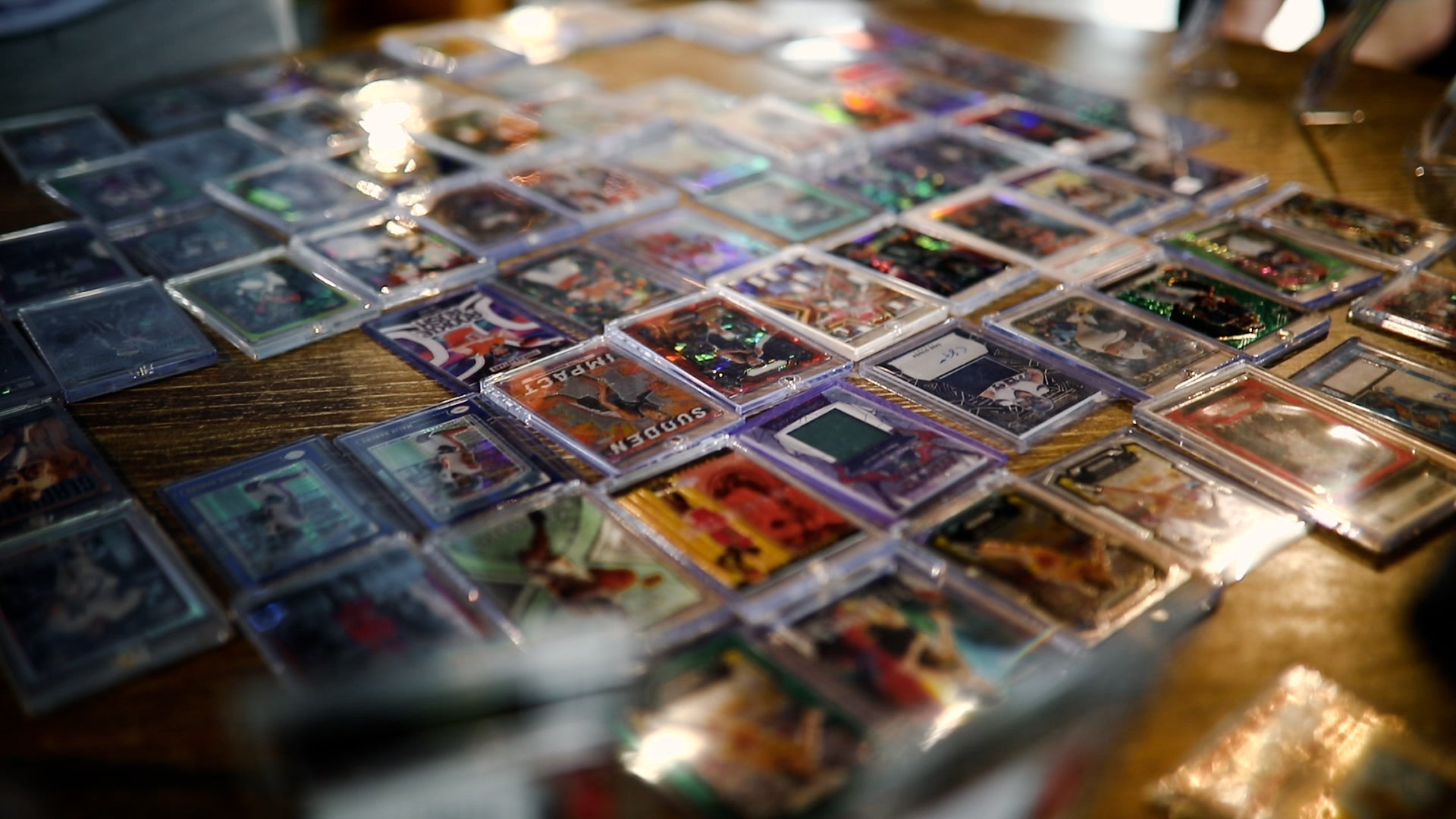 Collection of trading cards on a wooden surface